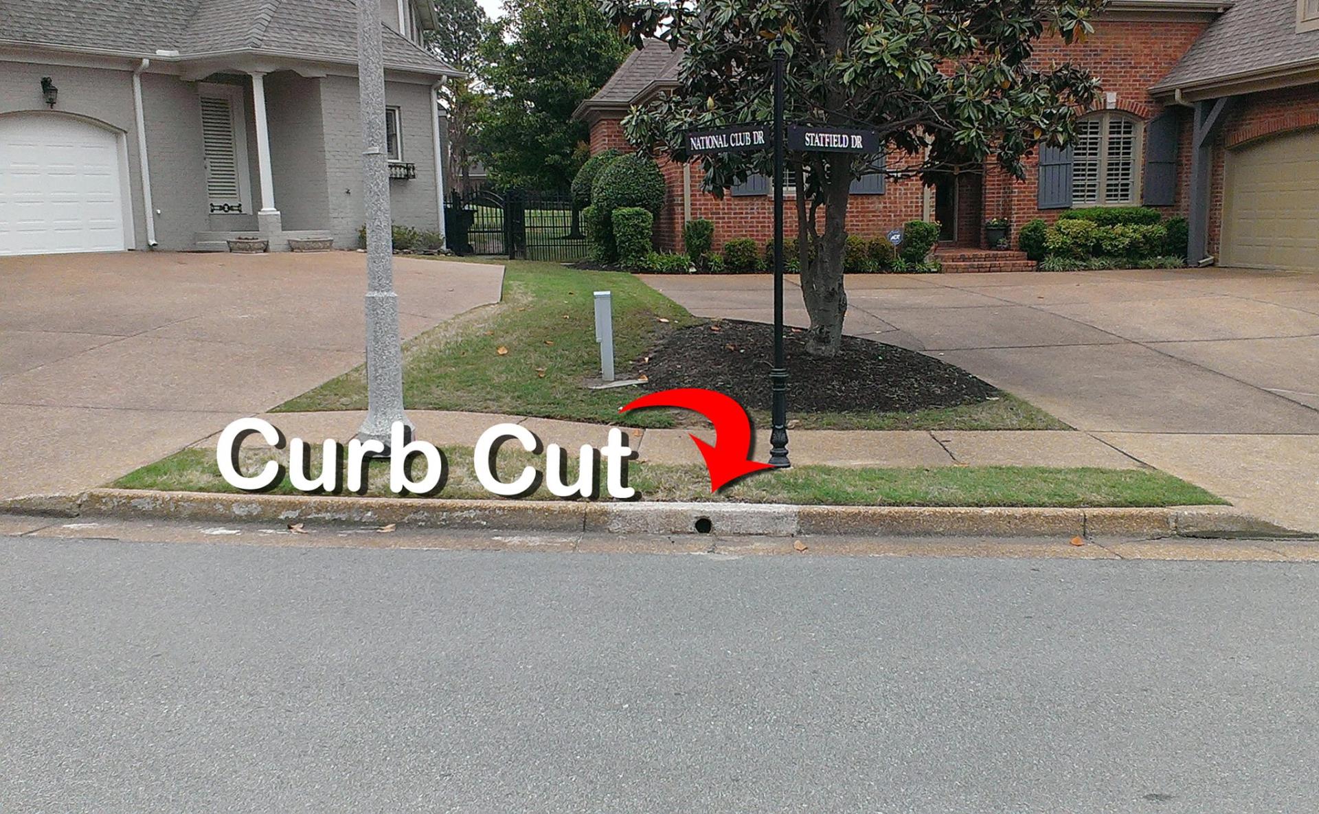 curb cut with red arrow
